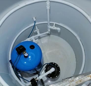 Установка насосного оборудования при обустройстве скважины кессоном